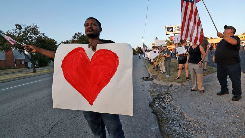 Petuel Jeanjacques, a Haitian immigrant, participates in a Peace Rally at the Clark County Democratic Party on Park Road in Springfield Wednesday, Sept. 18, 2024. BILL LACKEY/STAFF