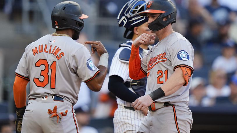 Baltimore Orioles' Cedric Mullins (31) celebrates with Austin Hays (21) after they scored on a home run by Hays against the New York Yankees during the seventh inning of a baseball game Thursday, June 20, 2024, in New York. (AP Photo/Frank Franklin II)