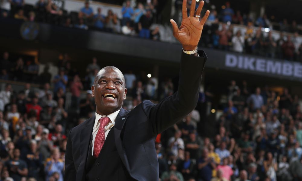 FILE - Retired Denver Nuggets center Dikembe Mutombo waves to the crowd as his jersey number was retired by the team during halftime of the Nuggets' NBA basketball game against the Portland Trail Blazers on Saturday, Oct. 29, 2016, in Denver. (AP Photo/David Zalubowski, File)