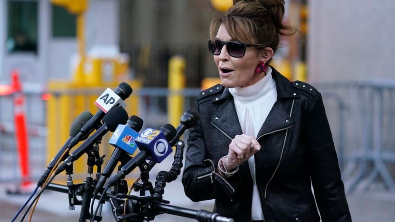 FILE - Former Alaska Gov. Sarah Palin speaks briefly to reporters as she leaves a courthouse in New York, Feb. 14, 2022. (AP Photo/Seth Wenig, File)