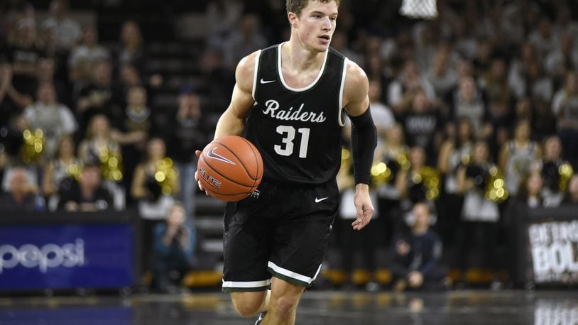 Wright State point guard Cole Gentry, shown here during a game earlier this season, scored 13 points Sunday in the Raiders’ win at IUPUI. Gentry’s consecutive free-throw streak came to an end one short of Jesse Deister’s school record of 47. FILE PHOTO