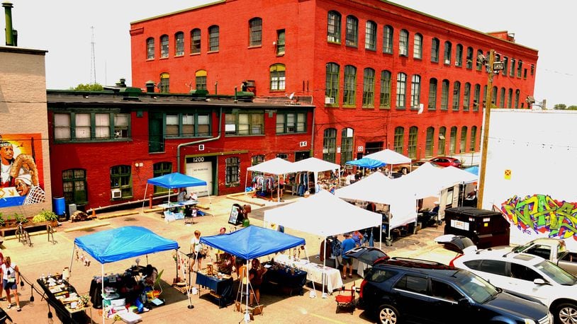 Dayton's art district on Front Street hosted a Father's Day Art Hop and Beer Garden on Sunday, June 18. Over 250 artists and vendors opened their studios and shops for the third annual event. Local food trucks and Fifth Street Brew Pub supplied the food and beer for the visitors to Front Street. DAVID A. MOODIE/CONTRIBUTING PHOTOGRAPHER