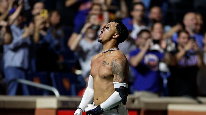 New York Mets' Mark Vientos reacts after hitting a two-run walkoff home run during the 10th inning of a baseball game against the Cincinnati Reds, Friday, Sept. 6, 2024, in New York. (AP Photo/Adam Hunger)