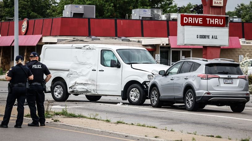 A police pursuit involving a stolen car that fled from police Friday afternoon, June 23, 2023, ended in a three-vehicle injury crash at North Springboro Pike and South Dixie Avenue in Moraine. JIM NOELKER/STAFF