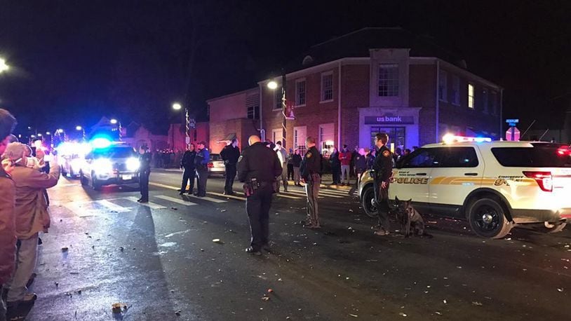 Yellow Springs police are seen early New Year’s Day after an apparent clash with revelers following an annual ball drop event in the village. MARGARET KINNER FISCHER / CONTRIBUTED