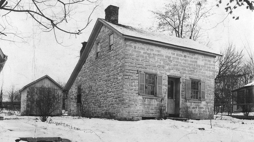 This stone house at 78 N. Main St. in Centerville is thought to have been built about 1810 by Aaron Nutt, one of the original surveyors and settlers in the area. The two-story building has stone walls 20” thick, a limestone cellar and a trap door. It also  features a central doorway with a pedimented hood and rectangular windows with stone lintels.
