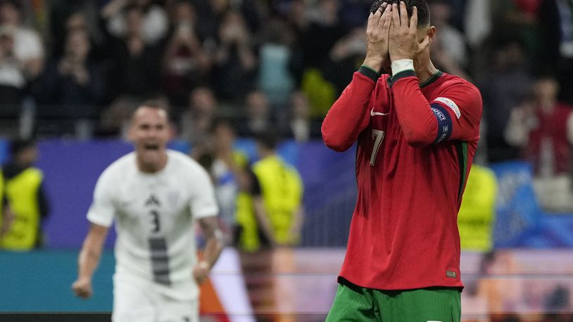 Portugal's Cristiano Ronaldo reacts after he failed scoring a penalty during a round of sixteen match between Portugal and Slovenia at the Euro 2024 soccer tournament in Frankfurt, Germany, Monday, July 1, 2024. (AP Photo/Matthias Schrader)