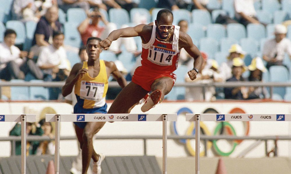 FILE - In this Sept. 23, 1988, file photo, Edwin Moses of the United States, right, pulls ahead of Allan Ince of Barbados during heat competition in the men's 400 meter hurdles at the Olympics in Seoul, Korea. (AP Photo/Lennox McLendon, File)