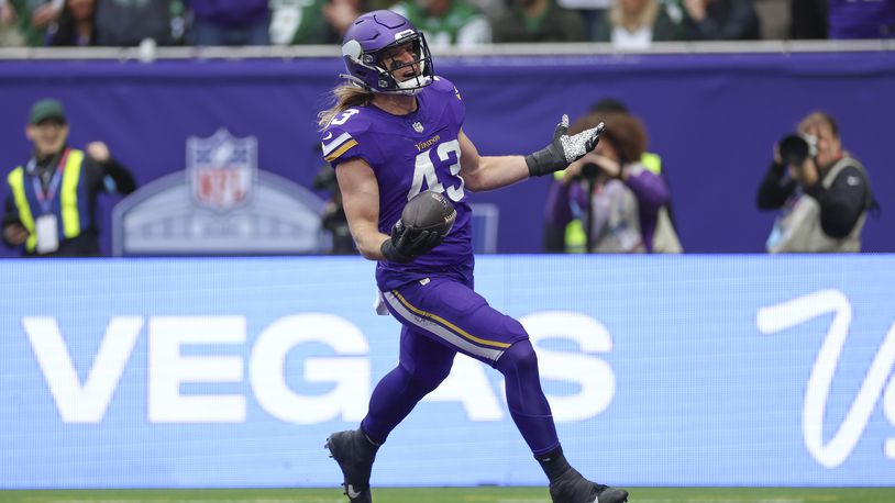 Minnesota Vikings' Andrew Van Ginkel celebrates as he scores after an interception during the first half of an NFL football game against the New York Jets, Sunday, Oct. 6, 2024, at the Tottenham Hotspur stadium in London. (AP Photo/Ian Walton)