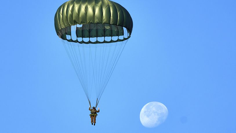 Parachutists jump over Ginkel Heath Netherlands, Saturday, Sept. 21, 2024, to mark the 80th anniversary of an audacious by unsuccessful World War II mission codenamed Market Garden to take key bridges in the Netherlands. (AP Photo/Phil Nijhuis)