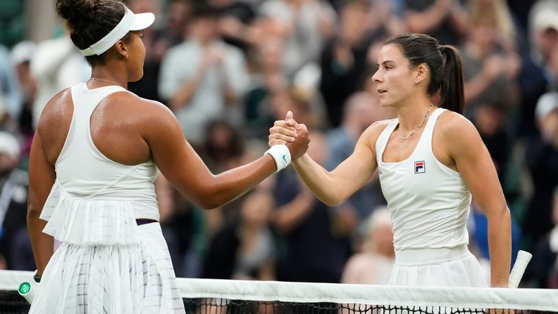 Emma Navarro, right, of the United States is congratulated by Naomi Osaka of Japan following their match on day three at the Wimbledon tennis championships in London, Wednesday, July 3, 2024. (AP Photo/Alberto Pezzali)