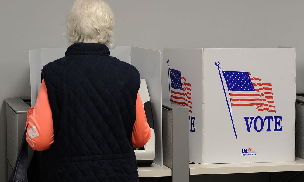 In this file photo a woman votes early at the Montgomery County Board of Elections Thursday Oct. 28, 2021. In May 2024 Ohio Secretary of State Frank LaRose announced he'll be removing the names of 