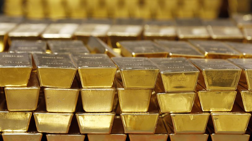 FILE - Gold bars are shown stacked in a vault at the United States Mint, on July 22, 2014, in West Point, N.Y. (AP Photo/Mike Groll, File)