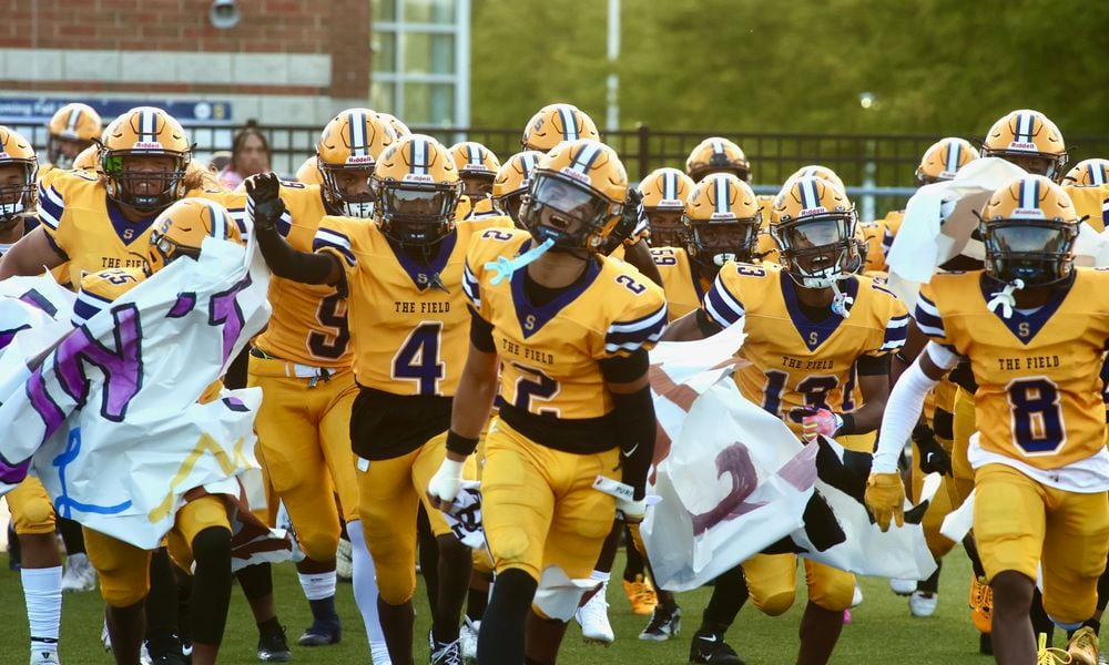 Springfield takes the field before a game against Winton Woods on Friday, Aug. 23, 2024, in Springfield. The Wildcats defeated Miamisburg on Friday night. David Jablonski/Staff