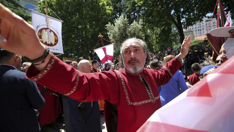 FILE - A Georgian Orthodox Church clergyman attends a celebration of the Day of Family Purity in the conservative country where animosity toward LGBTQ+ people is strong, in Tbilisi, Georgia, on May 17, 2024. (AP Photo/Zurab Tsertsvadze, File)