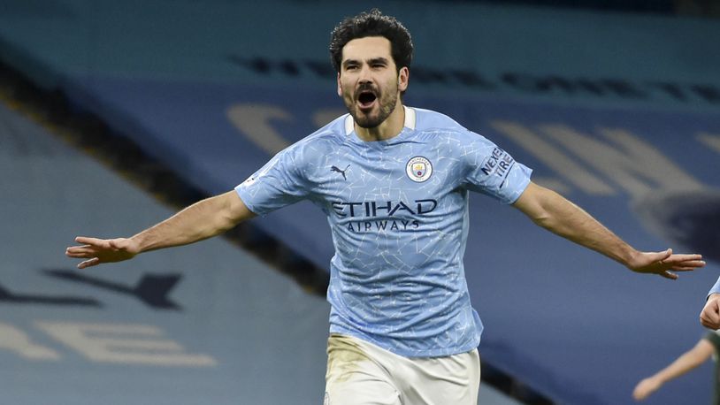 FILE - Manchester City's Ilkay Gundogan celebrates after scoring his side's third goal during the English Premier League soccer match between Manchester City and Tottenham Hotspur at Etihad Stadium, Manchester, England, on Feb. 13, 2021. Ilkay Gundogan is back at Manchester City for a sequel few could have expected. (AP photo/Rui Vieira, Pool File)