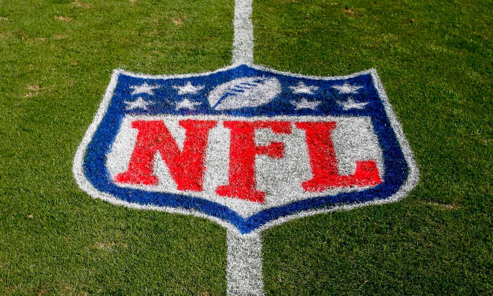 FILE - The NFL logo is displayed on the field at the Bank of American Stadium, Nov. 4, 2018, in Charlotte, N.C. The judge who presided in the class-action lawsuit filed by Sunday Ticket subscribers against the NFL said the jury did not follow his instructions in determining damages. (AP Photo/Nell Redmond, File)