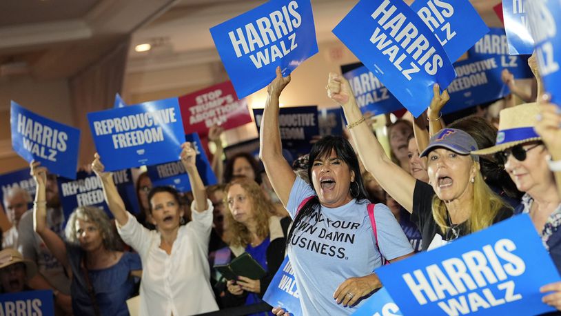 FILE - Supporters cheer as speakers arrive at an event kicking off a national "Reproductive Freedom Bus Tour" by the campaign of Democratic presidential nominee Vice President Kamala Harris and running mate Gov. Tim Walz, Sept. 3, 2024, in Boynton Beach, Fla. (AP Photo/Rebecca Blackwell, File)