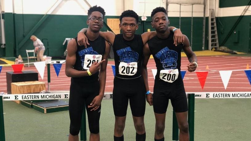 Qua’Lek Shelton, center, who died this week after being shot on Catalpa Drive on Sunday, was a national champion runner. He is pictured here with his relay teammates, at left, Mason Louis and a right, Daishuan Gossett. CONTRIBUTED