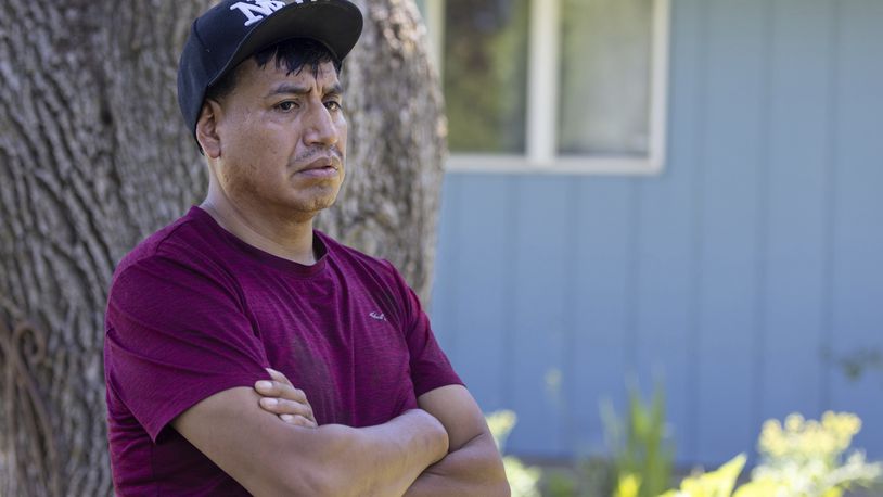 Alberto Bautista stands in the front yard where he and several other people were shot the day before in Crete, Neb. on Saturday, June 29, 2024. (Chris Machian/Omaha World-Herald via AP)