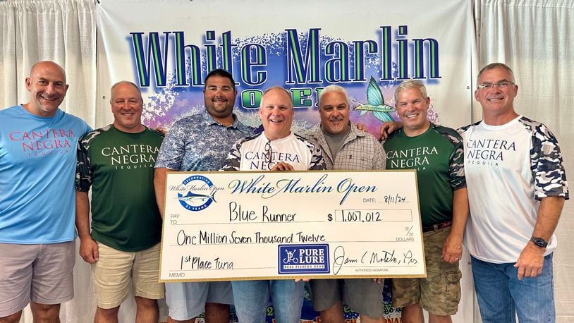 Team Buckeye Tuna – (left to right: Jarrod Keely; Dave Dunton; mate Drew Kegreiss; Rob Jones; Captain Mark DeBlasio; Jamie Greer; Lance Gildner) with their $1,007,000.00 check for winning the tuna division of the White Marlin Open last week In Ocean City Maryland. It is the largest and richest billfish tournament in the world. Their bigeye tuna weighed 220.5 pounds. CONTRIBUTED