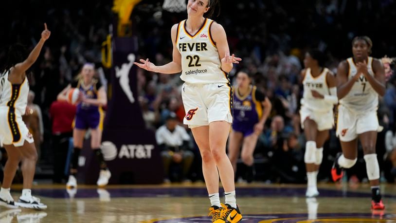 Indiana Fever guard Caitlin Clark (22) celebrates after making a 3-pointer during the second half of a WNBA basketball game against the Los Angeles Sparks in Los Angeles, Friday, May 24, 2024. (AP Photo/Ashley Landis)