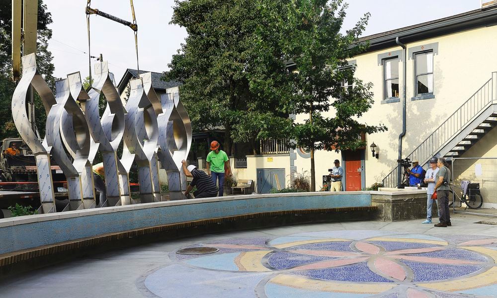 The Seed of Life sculpture for the Oregon District shooting memorial was craned in Thursday, July 25, 2024. MARSHALL GORBY\STAFF