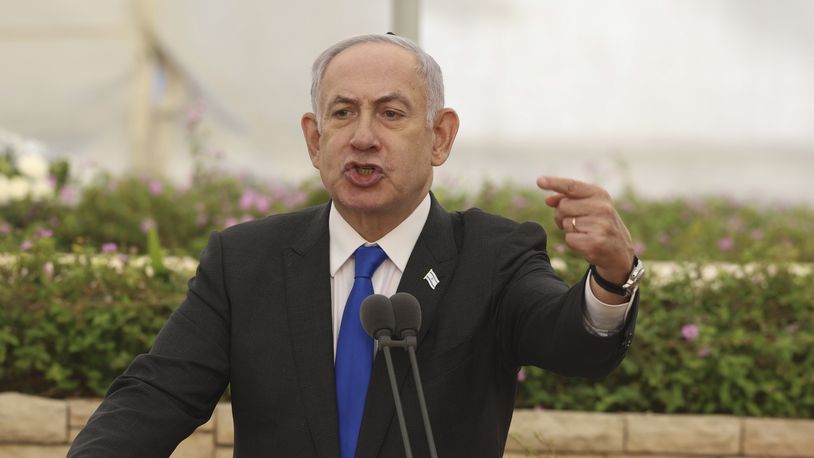 Israeli Prime Minister Benjamin Netanyahu speaks during a ceremony at the Nahalat Yitshak Cemetery in Tel Aviv, Israel, Tuesday, June 18, 2024. The ceremony marked the annual memorial for people killed in Israel’s Altalena affair -- a violent clash between rival Jewish forces that nearly pushed the newly independent Israel into civil war in 1948. (Shaul Golan/Pool Photo via AP)