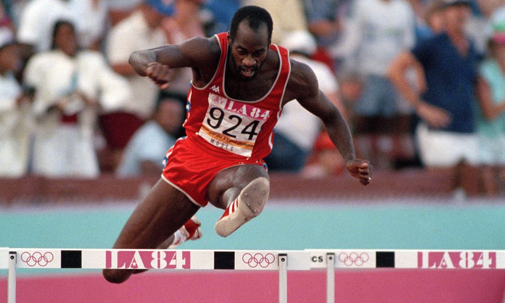 FILE - United States' Edwin Moses jumps a hurdle on his way to winning the gold medal in the 400-meter hurdles at the Summer Olympic Games in Los Angeles, Aug. 5, 1984. (AP Photo/File)