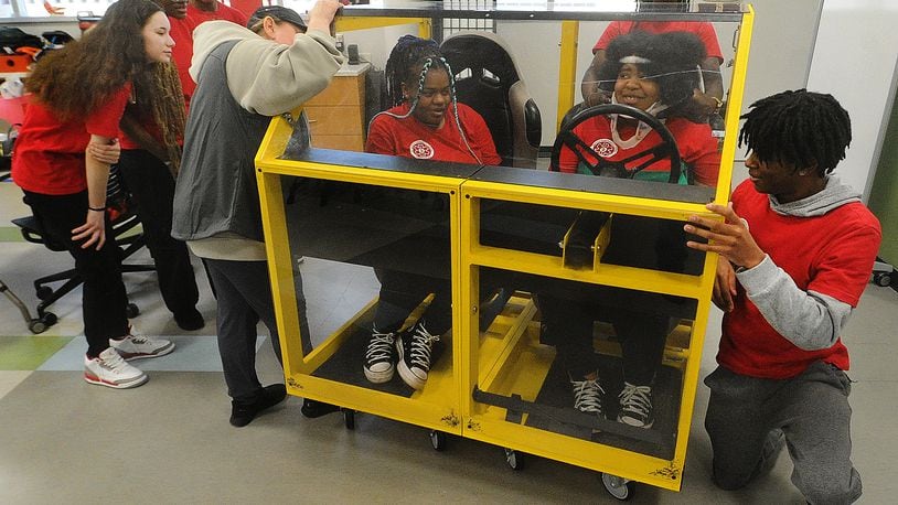 Trotwood High School students participate in a lab Tuesday, Feb. 13, 2024 as part of the Sinclair Emergency Medical Services Program. MARSHALL GORBY\STAFF