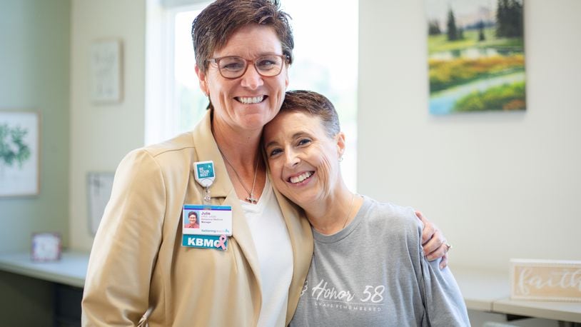 Chris Williford, of Miamisburg, (right) and Julie Manuel, clinical program manager at Kettering Health Behavioral Medical Center and manager of the center's intensive outpatient program. Williford, a survivor of the 2017 Route 91 Harvest Music Festival mass shooting in Las Vegas, participated in the intenstive outpatient program to help her cope with PTSD. COURTESY OF KETTERING HEALTH
