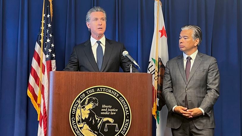 California Gov. Gavin Newsom, left, speaks next to Attorney General Rob Bonta during a press conference regarding a settlement with the city of Elk Grove, Wednesday, Sept. 4, 2024, in Sacramento, Calif. (AP Photo/Sophie Austin)