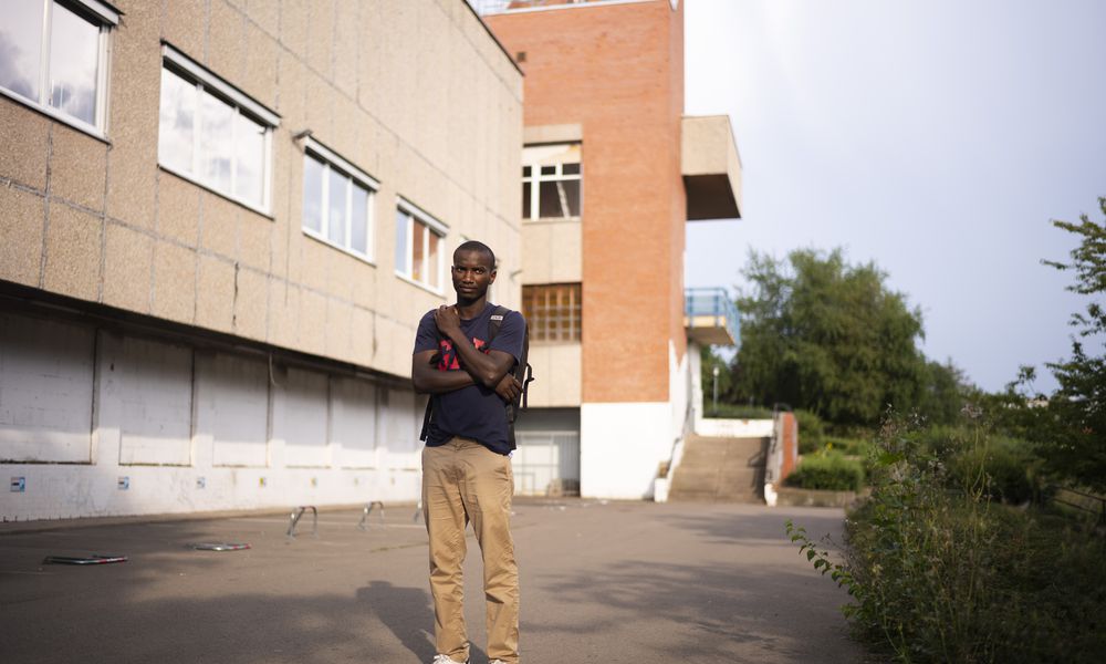 Omar Diallo, a 22-year-old migrant from Guinea in West Africa, poses for a portrait prior to an interview with The Associated Press near a dilapidated storage building were he and two friends being hunted and beaten up in 2020, in Erfurt, Germany, Wednesday, Aug. 14, 2024. (AP Photo/Markus Schreiber)