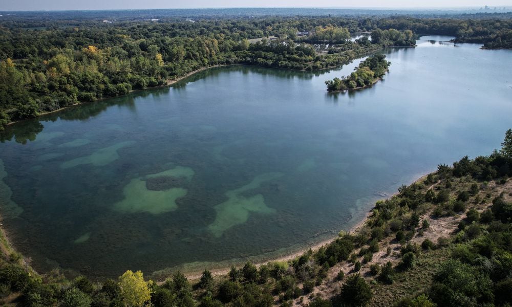 A drone from the Trotwood crews searching for the missing swimmer at Madison Lakes Park in Trotwood. JIM NOELKER/STAFF