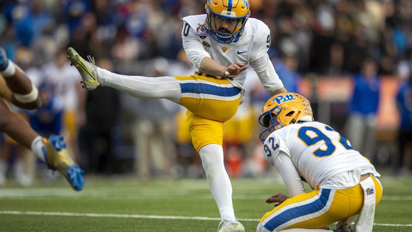 Pittsburgh placekicker Ben Sauls (90) boots the winning field goal during the second half of the Sun Bowl NCAA college football game against UCLA, Friday, Dec. 30, 2022 in El Paso, Texas. (AP Photo/Andres Leighton)