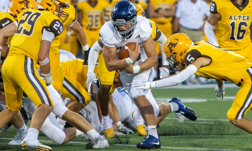 Fairmont's Logan Doty rushes for some of the 91 yards he gained on 26 carries in Thursday night's 24-7 win over Alter. Doty scored three 1-yard touchdowns. Jeff Gilbert/CONTRIBUTED