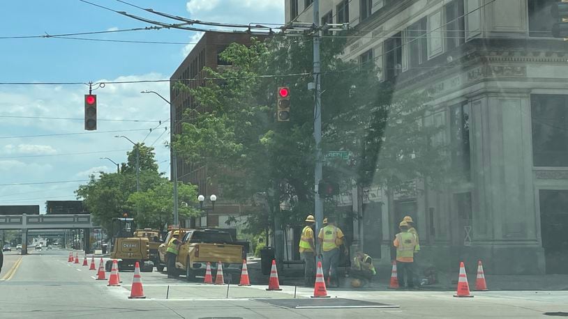 Crews working on Fifth and Main streets in downtown Dayton on June 1. Data from the Health Policy Institute of Ohio shows more individuals of working age in Ohio are dying, correlating with a lower labor force participation rate. SAMANTHA WILDOW\STAFF