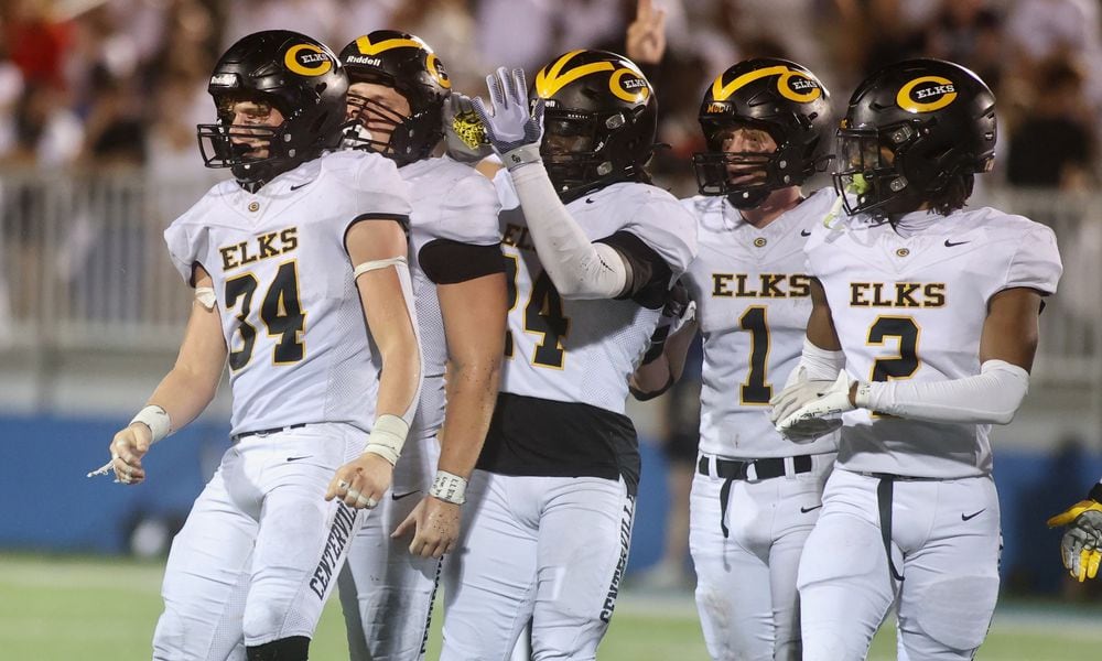 Centerville players, including Lucas Mullinger (34), react after a defensive stop against Fairmont on Friday, Sept. 13, 2024, at Roush Stadium. David Jablonski/Staff