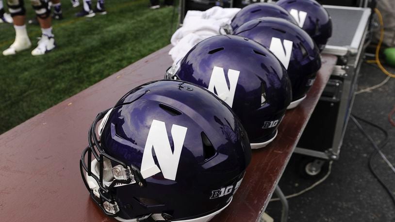 FILE - Northwestern helmets sit on a table during an NCAA college football against Stanford in Evanston, Ill, Saturday, Sept. 5, 2015. A team of investigators led by former U.S. Attorney General Loretta Lynch recommended Thursday, June 27, 2024, that Northwestern enhance its hazing prevention training in the wake of a scandal that rocked the school's athletic department. (AP Photo/Matt Marton, File)