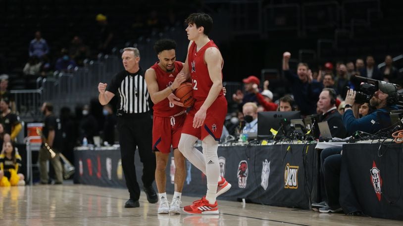 Richmond's Jacob Gilyard and Andre Gustavson celebrate after a steal by Gustavson late in their Atlantic 10 quarterfinal game against Virginia Commonwealth on Friday, March 11, 2022, at Capital One Arena in Washington, D.C. David Jablonski/Staff