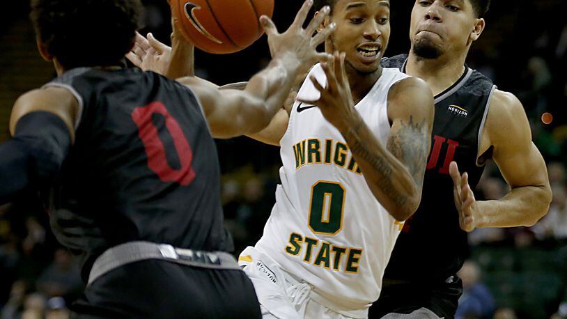 Wright State University guard Jaylon Hall cuts between IUPUI’s Jaylen Minnett (0) and Marcus Burk during a Horizon League game at the Nutter Center in Fairborn Sunday, Feb. 16, 2020. Wright State won 106-66. Contributed photo by E.L. Hubbard