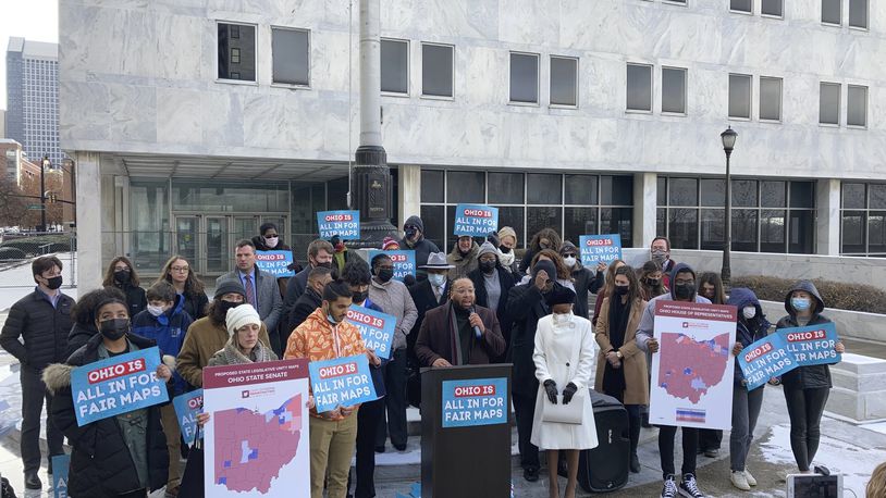 FILE - Advocates who believe that newly drawn Ohio legislative maps remain heavily gerrymandered rally outside the Ohio Supreme Court, Dec. 8, 2021, in Columbus, Ohio. (AP Photo/Andrew Welsh-Huggins, File)