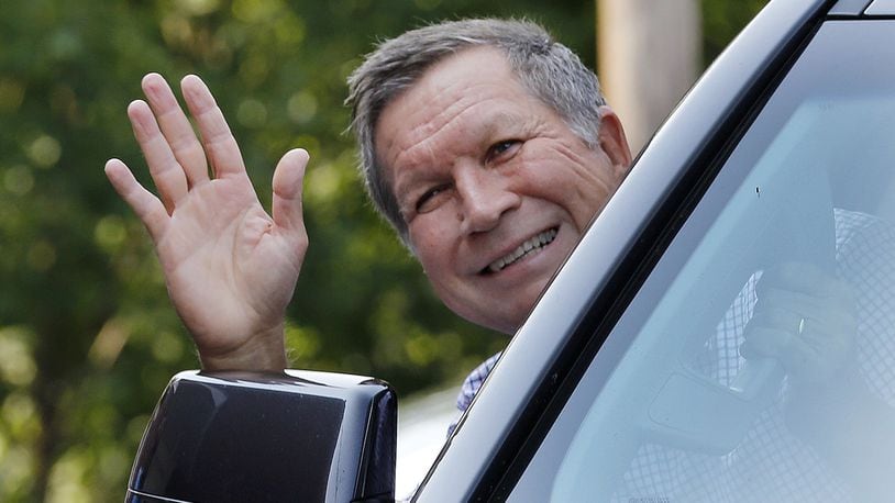 Republican presidential candidate Gov. John Kasich, R-Ohio, waves as he arrives Wednesday for a campaign stop at Robie's Country Store in Hooksett, N.H. The nation's first presidential primary in New Hampshire is less than six months away.