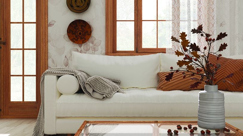 Making a home cozy can include adding warm colors, lighted candles, a fireplace and new, plush blankets. METRO NEWS SERVICE