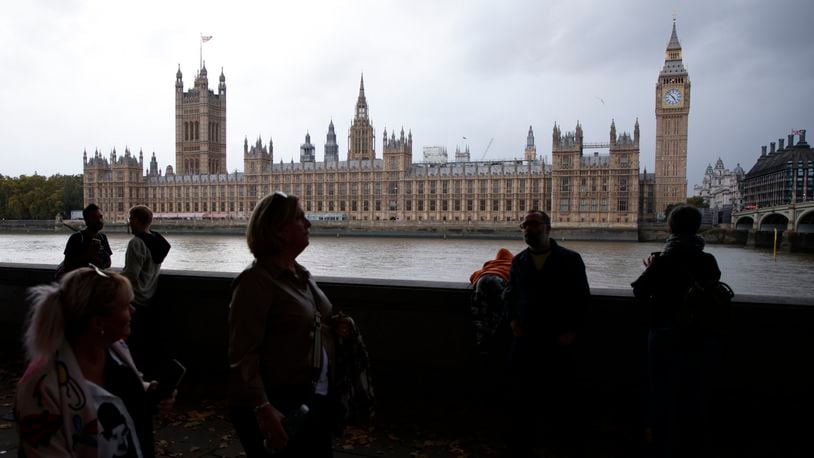 FILE - A general view of the Houses of Parliament at sunrise in London, Friday, Oct. 21, 2022. From red wall to king's speech, UK elections have a vocabulary all their own. (AP Photo/David Cliff, File)