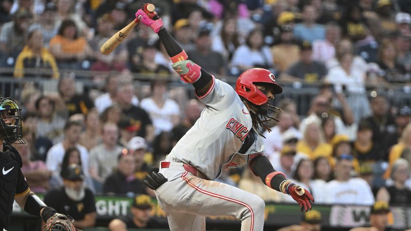 Cincinnati Reds' Elly De La Cruz, right, hits an RBI double against the Pittsburgh Pirates in the fourth inning of a baseball game, Saturday, Aug. 24, 2024, in Pittsburgh. (AP Photo/Barry Reeger)