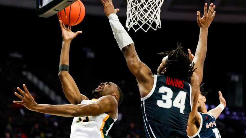 Norfolk State's Jack Doumbia (33) shoots against Howard's Bryce Harris (34) during an NCAA college basketball game in Mid-Eastern Athletic Conference men's tournament semifinals Friday, March 15, 2024, in Norfolk, Va. (Billy Schuerman/The Virginian-Pilot via AP)