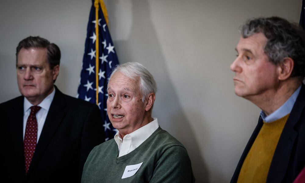 Chairman of the Delphi Salaried Retirees Association, Bruce Gump, center, talks about the struggles the retirees are living through without their pensions. JIM NOELKER/STAFF