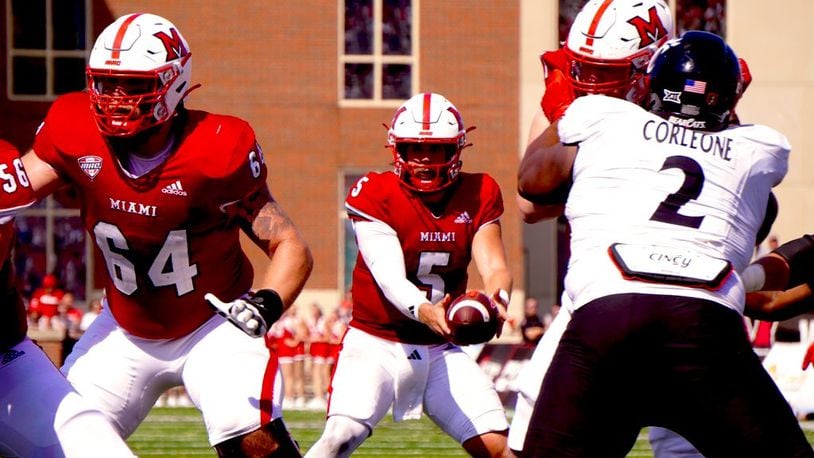 Miami's Brett Gabbert takes a snap against Cincinnati on Saturday. Chris Vogt/CONTRIBUTED