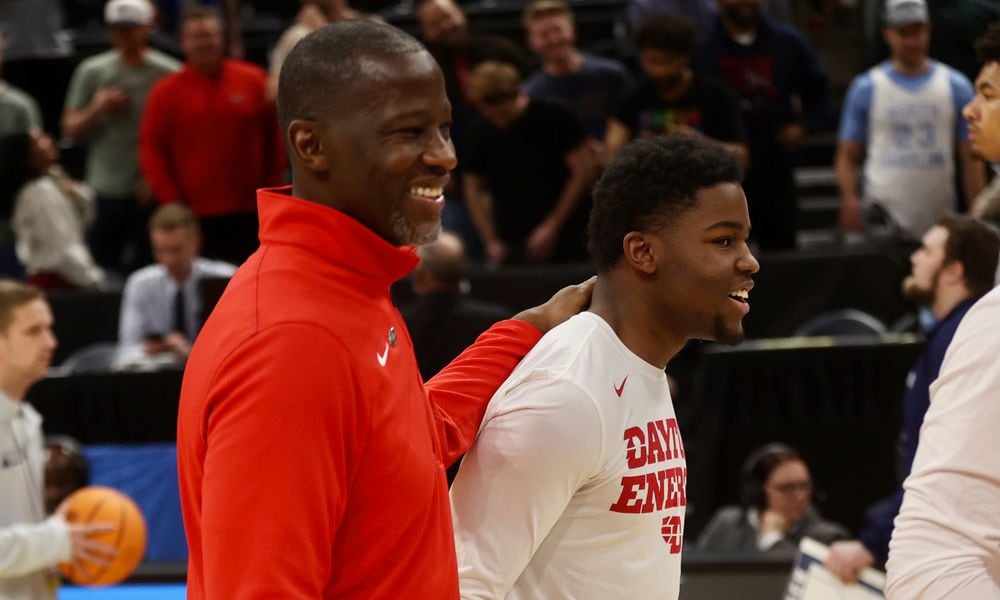 Dayton's Anthony Grant and Makai Grant leave the court after a victory against Nevada in the first round of the NCAA tournament on Thursday, March 21, 2024, at the Delta Center in Salt Lake City, Utah. David Jablonski/Staff